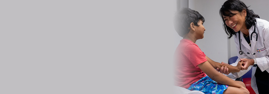 Female doctor with male child