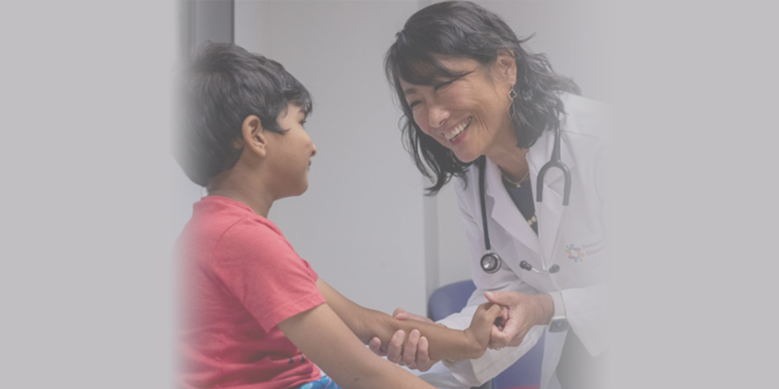 Female doctor with male child
