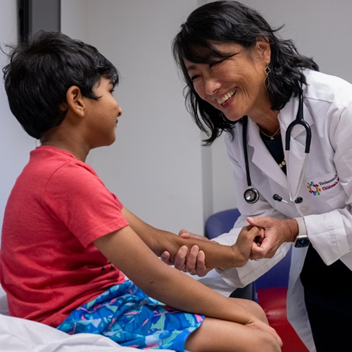 Female Doctor with Child Patient